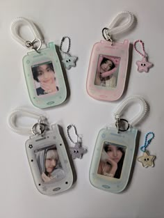 four different key chains with pictures on them