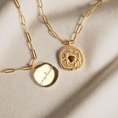 This exquisite gold wax seal necklace is a perfect blend of elegance and personalization, making it a unique accessory for any occasion. Crafted with meticulous attention to detail, this necklace features a beautifully designed wax seal pendant that can be customized with an engraving on the back. The pendant is gracefully suspended on a trendy paperclip chain, adding a modern touch to this classic piece. Key Features: Pendant Dimensions: Width: 0.98 inches, Height: 0.98 inches Necklace Length: 24 inches Material: High-quality gold Customization: Add a personalized engraving on the back of the pendant for a truly unique piece This necklace is not just an accessory, but a meaningful piece of jewelry that can carry a special message or memory close to your heart. It makes for an ideal gift f Gold Medallion Necklace With Charms As Gift, Gold Engraved Initial Pendant Medallion Necklace, Elegant Personalized Brass Charm Necklace, Gold Medallion Necklace With Engraved Initial Pendant, Gold Tarnish-resistant Locket Necklace Gift, Gold Initial Pendant Locket Necklace With Charms, Gold Locket Necklace With Initial Pendant And Charms, Gold Sterling Silver Initial Pendant Medallion Necklace, Elegant Tarnish Resistant Locket Necklace Gift