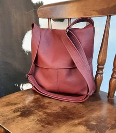 The PIONEER satchel bag Genuine 100%  Leather Bordeaux Rose Burgundy Oxblood Wine Small 21cm or 8 inches wide at bottom 23cm or 9 inches height 3 cm or 1.25 inch deep Medium 26cm or 10 inch width at bottom 28 cm or 11 inch in height 4cm 1.75 inch deep Large 30cm or 12 inches width at bottom 33cm or 13 inches height 5 cm or 2 inches deep Strap adjusts from 80cm to 145 cm or 31.5 to 55 inches   Specifics.. Made from new quality commercial upholstery grade leather Fully lined with large slip pocket Burgundy Leather Crossbody Flap Bag, Burgundy Flap Bag With Detachable Strap For Everyday Use, Burgundy Crossbody Flap Bag With Adjustable Strap, Burgundy Soft Leather Crossbody Shoulder Bag, Modern Burgundy Crossbody Bag, Burgundy Crossbody Satchel With Removable Pouch, Burgundy Leather-lined Crossbody Shoulder Bag, Burgundy Leather Lining Crossbody Shoulder Bag, Burgundy Leather Crossbody Shoulder Bag