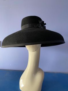 This beautiful large fur felt brimmed hat in black hand blocked custom-made by Wendy White Millinery. Add an air of elegance to your wardrobe whether it be for the races or a different event. This Hats head size is 22 1/2 inch Elegant Fur Felt Hat For Winter, Elegant Winter Top Hat With High Crown, Elegant High Crown Top Hat For Winter, Elegant Black Top Hat With High Crown, Black High Crown Hat For Evening, Black Fur Felt Top Hat For Winter, Black High Crown Top Hat For Races, Elegant Black High Crown Felt Hat, Black Fur Felt Hats For Party