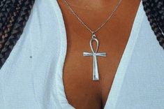 🤎 This listing is for a silver toned ankh necklace. 🤎 Necklace is handmade and constructed with hypoallergenic materials free of lead and nickel.  🤎 Chain is 18" long and hangs about 9" long. 🤎 Check out my listing for the matching earrings. https://www.etsy.com/listing/1007289711/silver-ankh-earrings?ref=shop_home_active_18 🤎 Each order is prepared and wrapped with love, just for you. 🤎 Care:  To care for your jewelry, store in pouch when not in use.  To clean the charm, create a paste us Ankh Necklace Silver, Bohemian Ankh Necklace In Metal, Adjustable Silver Ankh Necklace, Bohemian Silver Ankh Jewelry, Bohemian Ankh Silver Jewelry, Silver Ankh Cross Necklace Spiritual Style, Silver Ankh Cross Necklace In Spiritual Style, Silver Ankh Cross Spiritual Necklace, Ankh Earrings