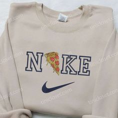 Pizza x Nike Embroidered Sweatshirt, Favorite Food Embroidered Sweatshirt, Nike Inspired Embroidered Shirt Welcome to Tinicloset, your deliciously stylish destination for custom embroidered clothing. Our store is a foodie’s dream, offering a delectable assortment of apparel, including the mouthwatering Pizza x Nike embroidered sweatshirt, favorite food embroidered sweatshirts, and Nike-inspired embroidered shirts. We believe that fashion should be as satisfying as a perfectly crafted pizza Casual Crew Top With Machine Embroidery, Casual Tops With Multicolor Embroidery And Logo, Long Sleeve T-shirt With Multicolor Embroidery, Casual Embroidered Multicolor Top, Embroidered Long Sleeve Tops For College, Crew Neck Sweatshirt With Multicolor Embroidery, Casual Long Sleeve T-shirt With Multicolor Embroidery, Casual Multicolor Embroidered Sweatshirt, Multicolor Embroidered Logo Sweatshirt Crew Neck