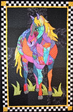 a quilt with a colorful horse on it