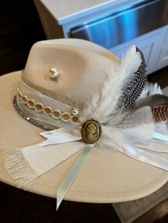 A custom bride's hat is one of my most popular hats.  Customized to fit your style. Painted, burnt and distressed, engraved.. whatever you want for your special day or for just pictures.  100% customized!  One Size Fits MOST. 22 3/8 circumference inner adjustable band. If you do not see a style you like, shoot us a message and we will try to create your vision!! Luxury White Felt Hat For Country Events, Elegant Top Hat With Short Brim For Western-themed Events, Elegant Top Hat With Short Brim For Western Events, Elegant Fedora With Flat Crown For Country Events, Elegant Fedora For Country Events With Flat Crown, Elegant Flat Brim Fedora For Western-themed Events, Elegant Fedora For Western-themed Events, Elegant Brimmed Hat For Western-themed Events, Elegant Felt Hat With Curved Brim For Western-themed Events