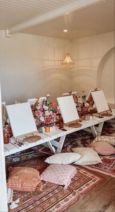 a room with mirrors and rugs on the floor