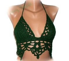 a green crocheted halter top on a mannequin headdress