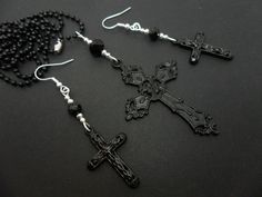 "A pretty black cross necklace and earring set. On a 27\" black ball chain. Brand new. Thanks for looking!!" Black Cross Pendant Jewelry Gift, Black Crucifix Jewelry For Jewelry Making, Gothic Black Cross Necklace Gift, Gothic Black Crucifix Cross Necklace, Black Cross Pendant Necklace Gift, Black Adjustable Crucifix Necklace, Adjustable Black Crucifix Necklace, Black Cross Necklace As Gift, Gothic Black Cross Pendant Necklace