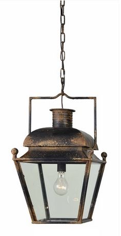 an old fashioned light hanging from a chain