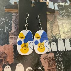 Art Face Earrings Hand Made By Me Good Condition, Never Used May Have Minor Imperfections Artsy Blue Dangle Earrings, Yellow Funky Earrings For Gift, Trendy Yellow Earrings With Ear Wire, Hand Painted Yellow Artsy Earrings, Yellow Hand Painted Artsy Earrings, Artistic Hand Painted Yellow Earrings, Whimsical Hand Painted Blue Earrings, Whimsical Blue Hand Painted Earrings, Fun Blue Drop Earrings