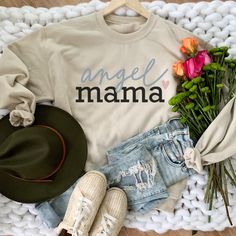 Angel Mama Heart Sweatshirt. HOW TO ORDER T-SHIRT 1- Please, Check and Review all Photos. 2- Choose your size from the drop-down menu 3- Select Your Shirt Color from Drop-down 2 4- Repeat for each shirt ordered 8 oz.(US) 13.5 oz.(CA), 50/50 preshrunk cotton/polyester Heather colors- 90/10 airlume combed and ringspun cotton/polyester Deep Heather Grey- 3.6 oz., 65% Polyester/35% Ring-Spun cotton Double-lined hood with color-matched drawcord Double needle stitching at shoulder, armhole, neck, wais Angel Mama, Angel Mom, Mama Crewneck, Mama Hoodie, Grandma Sweater, Womens Sweatshirts, Heart Sweatshirt, Retro Valentines, Mama Sweatshirt