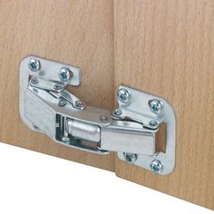 a close up view of a wooden door hinge