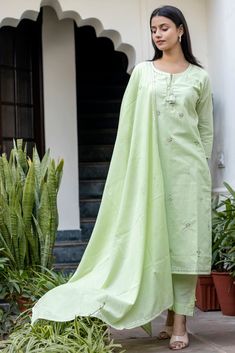 This is 3 piece set.It comes with mirror embellished kurta teamed with trouser and a dupatta to match. 3 Piece Set Fabric-Cotton Color-Green Work-Mirror embellished, embroidered & lace detailing with front & side tassels Kurta Detailing-Calf length kurta with side slits Bottom-Flared Sharara Sleeves-3/4th Sleeves Neck-Round Neck Occasion-Festive wear Washing care-Hand wash Embellished Suit, Peruvian Sweaters, Salwar Suit For Women, Kurta Pants, Cotton Salwar Suit, Suit Combinations, Pista Green, Mirror Embroidery, Long Kurtis