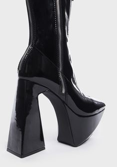 got you stuck in another dimension. These angular ankle boots have a patent vegan leather construction, an adjustable side zip and a decorative zip at top, pointed toes, chunky platforms, and flared block heels. Edgy High-cut Faux Leather Platform Boots, Edgy High Heel Platform Boots With Zipper Closure, Trendy Platform Boots With Zipper For Night Out, High Cut Faux Leather Boots For Party, Platform Boots With Zipper Closure For Night Out, Night Out Platform Boots With Zipper And Round Toe, Black High Cut Platform Boots In Polyurethane, Black High-cut Platform Boots In Polyurethane, Round Toe Platform Boots With Zipper For Night Out