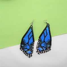 Blue Beaded Festival Earrings With Ear Wire, Blue Beaded Earrings For Festival With Ear Wire, Handmade Blue Butterfly Earrings, Adjustable Blue Earrings With Black Beads, Blue Dangle Earrings With Black Beads, Butterfly Fringe, Blue Butterfly Wings, Fringe Earring, Beadwork Earrings