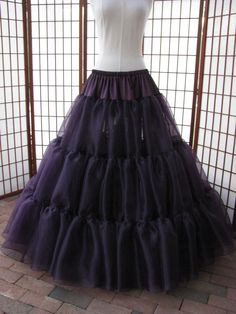 "This listing is for a custom order for the eggplant purple single layer petticoat in the photos. It will be made of soft polyester mirror organza with bridal satin waist and rolled hem. The pictured petticoat was designed for a 35\" (89cm) waist and is 45\" (114,5cm) long. Please feel free to ask me any questions :) WAIST: Please select your waist from the listed ranges in inches or centimeters. LENGTH: Please let me know your desired length. COLOR: Eggplant purple. Feel free to contact me if y Fitted Full Skirt Petticoat For Prom, Black Wedding Petticoat, Fitted Purple Petticoat, Fitted Purple Petticoat For Party, Circus Costume, Hoop Skirt, Eggplant Purple, Dressed To The Nines, Rolled Hem