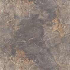 a close up view of a marble floor with brown and gray colors on it's surface