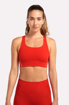 Our ALRN Crop Bra is made from post consumer waste products ( including fishing nets and carpets) and is sustainably produced in a method that significantly reduces water usage. This fabric offers excellent compression, coupled with stretch and breathability for the perfect amount of support without constriction. A clean finish neckline, armhole and under-bust ensures maximum comfort, even on your longest runs. Recycled Polyester Sports Bra With Built-in Padding For Training, 4-way Stretch Nylon Activewear For Light Sports, Nylon 4-way Stretch Activewear For Light Sports, Nylon Activewear For Light Sports With 4-way Stretch, Sweat-resistant Nylon Sports Bra With 4-way Stretch, Technical Nylon Activewear With Built-in Padding, Red Technical Moisture-wicking Activewear, High Stretch Sports Bra In Recycled Polyester, Functional Sports Bra With Mesh Back And 4-way Stretch