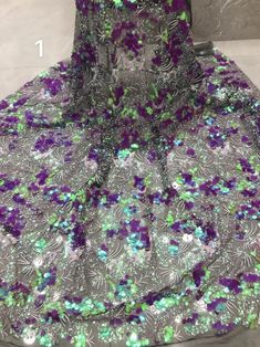 We offer a variety of fashion handmade fabric，those are widely use for wedding dress，garment and fashion cloth. we sell it by yard，our minimum order is 1 yards，and we always package it 15 yards for one roll，the width is about 125cm/45inch Material ： sequins ,mesh ，Rayon,polyester. Symmetrical embroidery floral pattern, with lovely flowers in the middle, scalloped border. You can also cut and use separately. Perfect for dress, tops, wedding veil. You can split the piece up and have one scalloped Purple Lace Embroidered Fabric For Party, Party Purple Lace Embroidered Fabric, Purple Lace Tulle Fabric For Party, Purple Lace Dress With Sequins, Purple Sequined Embroidered Fabric For Party, Party Purple Embroidered Sequined Fabric, Party Purple Embroidered Fabric With Sequins, Purple Party Embroidered Fabric With Sequins, Multicolor Lace Party Dress