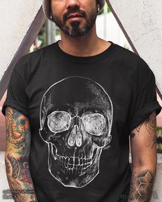 a man wearing a black shirt with a skull on it