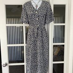 Pretty, Blue & White Tribal Print, Short Sleeved Maxi Dress. Rare Find! Pearl & Silver Buttons Down Front With Tie Around The Waist Beautiful Soft Fabric That Does Not Wrinkle. 100% Polyester, Machine Wash The Perfect Summer Dress! From Top Of Shoulder To Hem Is 49" Underarm To Underarm 21" Vintage 80's And Looks Brand New. Beautiful Retro Classic Look ! Casual Blue Vintage Dress With Short Sleeves, Vintage Blue V-neck Midi Dress, Sleeved Maxi Dress, Short Sleeve Maxi Dresses, Dress 12, Silver Buttons, Slate Blue, Silver Pearls, Perfect Summer