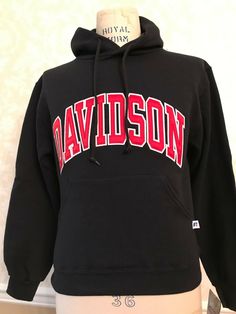 Davidson College Black Hooded Pullover Sweatshirt with Red Lettering Size XS New with tags Bought for a gift - too small, has been in my cedar closet since. Clean and in great, new condition from a non-smoking home Ready for a small person to wear it!   Great gift for a student's sibling. Davidson College, Cedar Closet, College Hoodies, Hooded Pullover, Hoodie Sweatshirt, Pullover Sweatshirt, Harley Davidson, Sweatshirts Hoodie, Tags