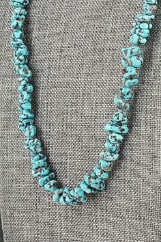 This beaded turquoise necklace with sterling silver end cones and hook was made by Navajo silversmith Louise Joe.Necklace: 22"Bead Size: 1/4" x 3/8" (approximate)Free shipping on all orders! We ship with USPS and always include tracking. All orders ship within a day of payment.Returns are accepted up to 30 days after you receive your order. Just send us a message. Our shop offers cash back or store credit. The item must be returned in new condition. Hand-strung Turquoise Western Necklace, Hand-strung Western Turquoise Necklace, Western-style Hand-strung Turquoise Necklace, Bear Carving, Pearl Chain, Native American Jewelry, Sterling Silver Necklace, Turquoise Sterling Silver, Free Jewelry