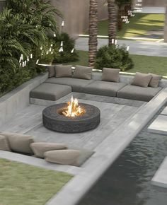 a fire pit sitting in the middle of a courtyard