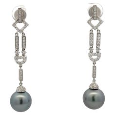 Deco inspired drop earrings featuring 84 round brilliants weighing 0.72 carats with two Tahitian pearls measuring 11-12 MM. Available in yellow gold. Pearls can be changed to South Sea, Pink Freshwater or Golden. Earring Video, White Gold Drop Earrings, Yellow Gold Drop Earrings, Diamond Bar, Diamond Drop Earrings, Diamond Drops, Tahitian Pearls, Pearl Diamond, Bar Earrings