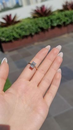 a woman's hand with a ring on it