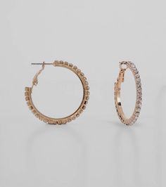 Add a pretty sparkle to all of your 'fits with these gorg rhinestone hoop earrings! They feature a medium metal hoop design with all-around rhinestone embellishments. Include an omega closure. Style these hoop earrings with a dainty necklace for everyday glamour!Fit & FeaturesMedium metal hoop designRhinestone embellishmentsOmega closure, rubber stopperEarrings are final sale and may not be returned or exchanged. Small Hoop Earrings With Rhinestones In Cubic Zirconia, Metal Hoop Crystal Earrings With Rhinestones, Hoop Crystal Earrings With Rhinestones, Metal Hoop Jewelry With Rhinestones, Glamorous Metal Hoop Earrings With Rhinestones, Trendy Metal Hoop Earrings With Rhinestones, Trendy Rhinestone Metal Hoop Earrings, Trendy Hoop Jewelry With Rhinestones, Hoop Jewelry With Sparkling Stones