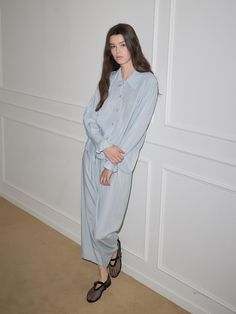 This pajama set features a relaxed fit for comfortable wear experience and shirt design exuding modern and classic mood.- Available in 2 colors: white and blue- Ruffle details at the sleeve to add appeal to the item- Made from a blended fabric with soft touch Light Blue Relaxed Fit Casual Sleepwear, Casual Light Blue Relaxed Fit Sleepwear, Oversized Long Sleeve Sets For Daywear, Light Blue Relaxed Fit Sleepwear For Loungewear, Relaxed Fit Light Blue Sleepwear For Loungewear, Blue Relaxed Fit Loungewear Sets, Blue Relaxed Fit Lounging Sets, Blue Relaxed Fit Lounge Sets, Relaxed Fit Blue Lounge Sets