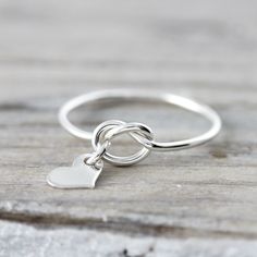 Cyber weekend SALE - Love knot ring with heart charm - recycled sterling silver ring by LeCubicule on Etsy https://www.etsy.com/listing/294381169/cyber-weekend-sale-love-knot-ring-with Wise Monkeys, Love Knot Ring, Star Cross, Mixed Metal Jewelry, Ringe Gold, Bracelet Charms, Knot Ring, Love Knot, Girly Jewelry