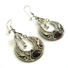 Beautiful ethnic women's jewelry filigree earrings, made from high-quality 925 sterling silver. The round dangle earrings are lightweight, which allows you to wear the earrings for a whole day. The earrings are inlaid with gemstones of your choice Onyx, Garnet, Amethyst, or Azurite gemstones. ♥ Wrapped in a gift box. ABOUT THE ITEM ----------------------- DIMENSIONS ♥ Length 2.2" (4cm) with ear hoop. ♥ Width 1.2" (3cm). ♥ weight 9 grams. ♥ Crafted from high-quality 925 Sterling Silver in a speci Elegant Sterling Silver Danglers With Oxidized Finish, Elegant Oxidized Sterling Silver Danglers, Ornate Silver Danglers With Filigree Details, Traditional Oval Filigree Earrings, Ornate Round Chandelier Earrings With Intricate Design, Ornate Oval Pierced Earrings, Ornate Nickel-free Chandelier Earrings, Ornate Filigree Drop Earrings Danglers, Elegant Oxidized Drop Danglers