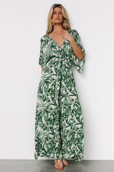 Summer V-neck Jumpsuit With Tie Back, Tropical Printed V-neck Jumpsuits And Rompers, Tropical V-neck Jumpsuits And Rompers For Summer, Tropical V-neck Jumpsuits And Rompers For Vacation, Green V-neck Maxi Dress With Tie Waist, Casual V-neck Jumpsuits And Rompers With Tropical Print, Chic Green V-neck Jumpsuit, Green Tropical V-neck Jumpsuits And Rompers, Chic Floral Print Jumpsuit With Short Sleeves