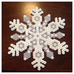 a snowflake made out of legos on a table