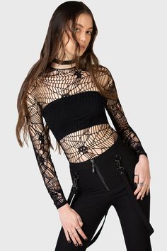 WEBS GRASP.- Soft, stretch fishnet.- Statement web style net with interwoven skulls.- Long sleeves.- Fitted.With KIHILIST branding, 94% Polyamide, 6% Elastane.Hand wash cold (30°c) / Do not bleach / Do not tumble dry / Iron at low temperature / Do not dry clean. Imported. Stretch Black Mesh Top With Hollow Out Details, Black Stretch Mesh Top With Hollow Out Details, Edgy Fishnet Top For Alternative Fashion, Alternative Fashion Black Fishnet Top, Edgy Fishnet Mesh Top For Night Out, Fitted Hollow Out Mesh Top For Party, Party Mesh Top With Hollow Out Detail, Black Sheer Mesh Top For Festival, Party Mesh Top With Hollow-out Details