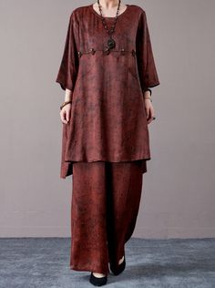 Elevate your everyday style with this rust brown two-piece set, featuring a relaxed-fit tunic and matching wide-leg pants. The tunic is adorned with subtle decorative accents for added charm, while the wide-leg pants ensure comfort and ease of movement. Perfect for casual wear or a laid-back evening look, this set can be accessorized with statement jewelry and classic footwear for a sophisticated finish. Key Features: Soft rust brown fabric Relaxed-fit tunic with decorative accents Comfortable wide-leg pants Easy-to-wear two-piece set Ideal for casual and evening wear Brown Two Piece, Tunic And Pants, Outfit Comfortable, Fitted Tunic, Top And Pants Set, Brown Fabric, Pants Casual, Decorative Accents, Puff Sleeve Top