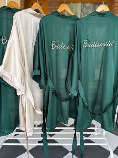 three bridesmaid shirts are hanging on a rack