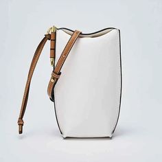 0 Modern White Shoulder Bag With Cell Phone Pocket, White Pouch Phone Bag With Adjustable Strap, Chic Rectangular Bucket Bag With Cell Phone Pocket, Everyday Rectangular Bucket Bag With Mobile Phone Bag, White Phone Bag With Adjustable Strap, White Everyday Use Phone Pouch Bag, Elegant White Bucket Bag With Mobile Phone Holder, Elegant White Bucket Bag With Phone Holder, Modern Shoulder Phone Bag