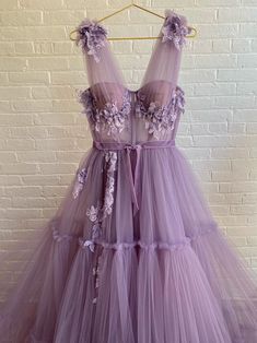 Get charmed in shades of vivid violet and handmade, embroidered lace flowers. Meet the Charming Violet Gown, perfect for days spent dancing or long nights out. Featuring a sheer bodice and a beautiful skirt made out of delicately gathered tulle. Boho Prom Dresses, Violet Gown, Boho Prom Dress, Boho Prom, Lace Long Prom Dress, Purple Prom, A Line Evening Dress, Purple Prom Dress, Mauve Purple