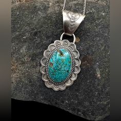 John Nelson Signed Navajo Handmade Sterling Silver Natural Royston Turquoise Pendant Necklace Orders Totaling $100 And Up Include An Anti-Tarnish Treated Velvet Jewelry Pouch! The Sterling Silver Chain Measures Approximately 24" Stamped Sterling And Is Pre-Owned The Pendant Measures Approximately 2 3/8" X 1.25" And Is New Bale Opening Measures Approximately 10mm Total Weight Is Approximately 22 Grams Condition: Chain Pre-Owned, Pendant New Metal: Sterling Silver. See Photos For Hallmark Comes In Southwestern Blue Concho Necklace, Southwestern Style Blue Concho Necklace, Blue Bohemian Concho Necklace, Bohemian Blue Concho Necklace, Southwestern Style Engraved Turquoise Necklaces, Southwestern Blue Turquoise Necklace With Concho, Southwestern Blue Concho Jewelry, Blue Western Sterling Silver Jewelry, Blue Sterling Silver Western Jewelry