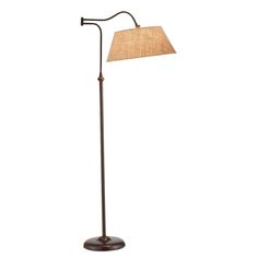 a floor lamp with a brown shade on it's base and a light bulb