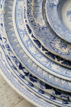 blue and white plates stacked on top of each other