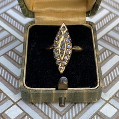 Sweet Victorian 14K yellow gold & rose cut diamond ring in a marquise shape! There are 17 rose cut diamonds across the front of the ring in a marquise setting. The diamonds measure 1.5mm to 2.25mm each, and have natural inclusions. Please ask all necessary questions prior to placing an order. Measurements: The size is 6 US, and can be sized for a fee. Condition: The overall all condition of this ring is very good. Victorian 14k Gold Ring With Rose Cut Diamonds, Victorian 14k Gold Diamond Ring With Rose Cut Diamonds, Marquise Diamond White Ring With 17 Jewels, Antique Marquise Rose Cut Diamond Ring, Victorian Marquise Cut Yellow Gold Diamond Ring, Victorian Marquise Yellow Gold Diamond Ring, Victorian Gold Cluster Ring With Rose Cut Diamonds, Art Deco Gold Cluster Ring With Rose Cut Diamonds, Marquise Cluster Ring With Rose Cut Diamonds