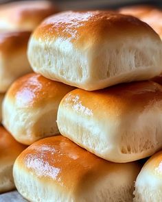 a pile of bread rolls sitting on top of each other