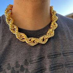 Get ready to make a statement with this Mens 14k Gold Plated Chain Hollow Rope Big Dookie! 🔥💪 Perfect for any hip hop enthusiast, this stunning chain is 20MM x 20" and screams style and confidence. 😎💰 Grab it now and elevate your fashion game. #RopeNecklace #HipHopJewelry #HipHopChain #MensNecklace #BlingCartel #GoldChain #RopeChain Gold Plated Cuban Link Rope Chain Necklace, Gold Rope Chain Necklace, Round Shape, Yellow Gold Necklaces With Cuban Link Rope Chain, Yellow Gold Necklace With Cuban Link Rope Chain, Gold Necklaces With Rope Chain And Link Shape, Rope Chain Necklace Gift, Gold Rope Chain Necklace, Solid Necklace, Hip Hop Chains