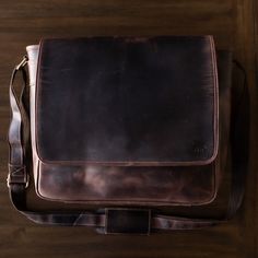 A small town of only 550 people; Kasilof, Alaska is rugged, majestic and full of life. There's no better way to describe this leather messenger bag. The Kasilof is clean, rugged and built to last. An invisible magnetic closure secures and protects your items and an extra-large interior gives ample room to store all your gear. Made from luxurious top-grain leather, this leather messenger bag screams wild and free, yet maintains that business professional look that stands out in the crowd. This ma Rugged Leather Satchel Laptop Bag, Rugged Shoulder Bag With Leather Backing, Rugged Rectangular Laptop Bag For Everyday Use, Rugged Oiled Leather Shoulder Bag With Leather Backing, Rugged Leather Shoulder Bag, Rugged Shoulder Bag With Oiled Leather And Leather Backing, Rugged Everyday Laptop Bag, Rugged Leather Laptop Bag For Travel, Rugged Laptop Bag