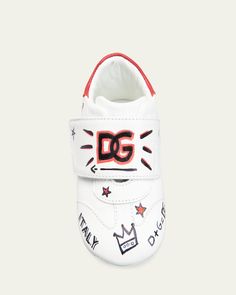 Dolceamp;Gabbana sneakers in lambskin leather with graffiti typographic print     Flat heel    Round toe    Gripstrap vamp     Interlocking DG logo print on heeltab    Made in Italy Designer Logo Print Sneakers With Round Toe, Designer High-top Sneakers With Embroidered Logo, Leather Slip-on Sneakers With Logo, Graffiti Logo, Dg Logo, Printed Flats, Dolce And Gabbana Kids, Typographic Print, Lambskin Leather