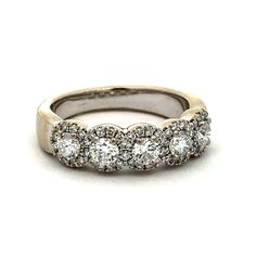 a wedding ring with five diamonds on it