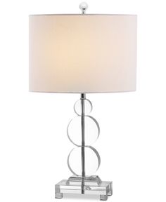 a table lamp with a white shade on it